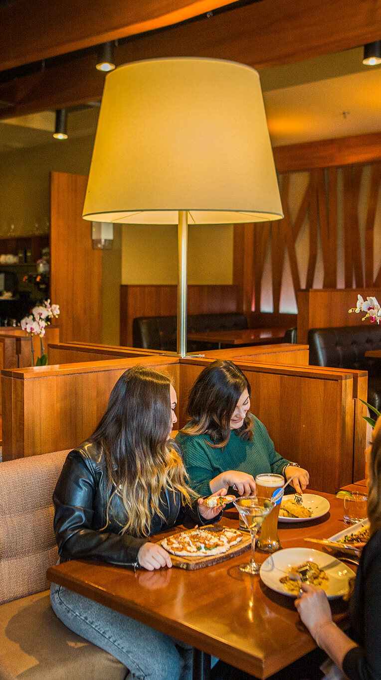 A group of four eating at the Redwater Rustic Grille