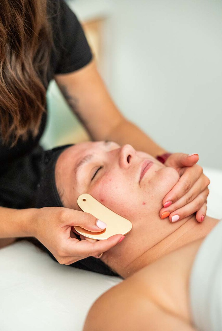 A woman receiving a face massage